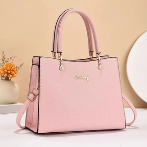 Pink lychee grain leather handbag for women with gold logo and floral pendant charm