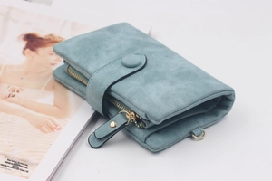 Close-up of light blue frosted PU leather wallet with snap closure and metal ring detail
