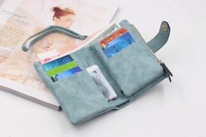 Detail view of the trifold light blue frosted wallet interior with card slots and cash pocket