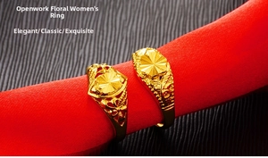 Detail of adjustable gold-finish ring with sunflower pattern and intricate openwork