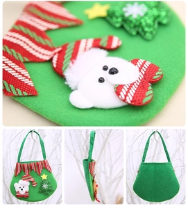 Detail of green felt Christmas gift bag featuring 3D bear and sequin tree design