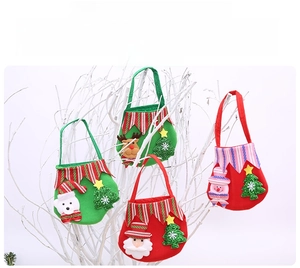 Detail of felt Christmas gift bags with Santa, Reindeer, and Snowman cartoon designs
