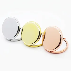 Three round portable folding metal makeup mirrors in silver, gold, and rose gold finishes
