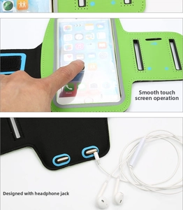 Detail of running armband with clear touch screen window and dual headphone jack ports