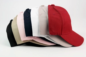 Classic cotton baseball caps shown in seven various colors with curved brims