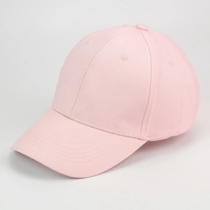 Detail view of pink cotton baseball cap featuring six-panel crown and curved brim