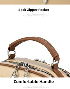 Close-up of comfortable brown leather handle and zipper detail on beige shoulder bag