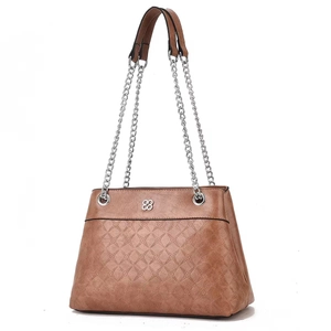 Macro shot of brown rhombic quilted leather texture with delicate floral embossing