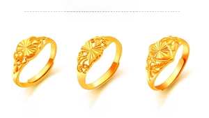 Detailed view of three adjustable gold-plated heart and butterfly rings with open bands