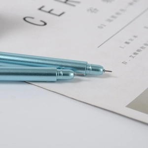Macro shot of light blue metal texture gel pen with precision fine needle tip on paper