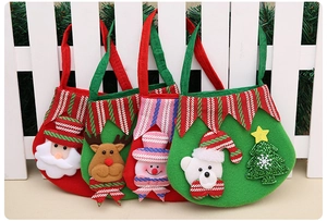 Detailed view of 3D Christmas felt gift bags with Santa, reindeer, and snowman appliques