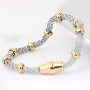 4mm stainless steel mesh chain bracelet with 18K gold beads on white marble background