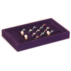 Purple velvet jewelry tray detail with 7 parallel slots displaying various rings