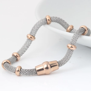Macro shot of 4mm stainless steel mesh chain bracelet with elegant rose gold beads