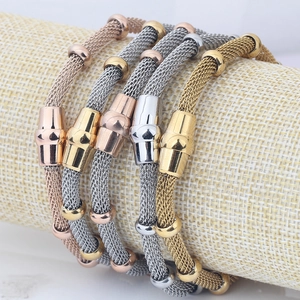 Macro detail of 4mm stainless steel mesh chain bracelets in gold and silver finishes