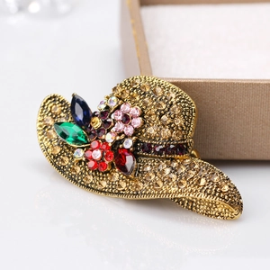 Vintage gold sun hat brooch with colorful crystals and sparkling rhinestones