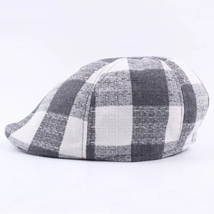 Classic black and white checkered flat cap with textured woven fabric for outdoor wear