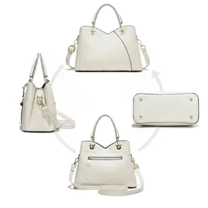 Detailed views of beige crossbody handbag showing hardware, bottom studs, and inner pockets
