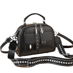 Classic black leather crossbody bag with silver hardware and trendy geometric wide strap