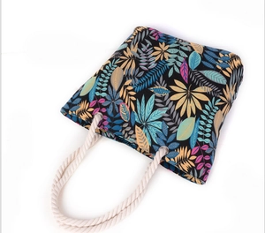 Minimalist canvas tote bag with colorful leaf print and white hemp rope handles