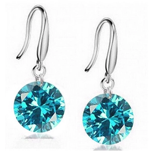 Detailed view of 8mm sea blue round brilliant cut stone earrings with silver hooks