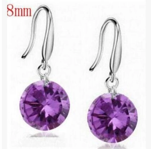 Detail view of 8mm purple zircon drop earrings with silver hooks on white background