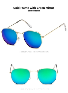 Detailed view of hexagonal gold metal frame sunglasses with green mercury mirror lenses