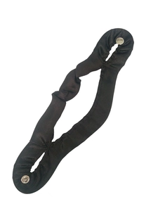 Detail of black satin hair bun maker tool featuring smooth fabric and silver metal snaps