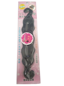 Detail of black sponge hair bun maker tool showing flexible design for 20-second styling