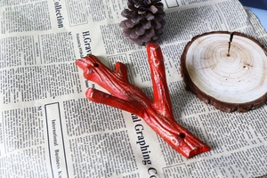 Rustic red branch cast iron wall hook with vintage finish for home organization
