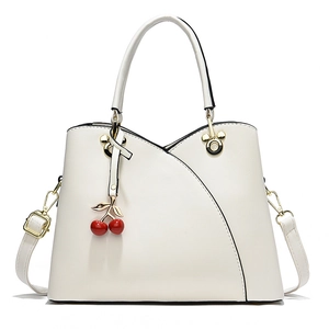 Elegant cream white faux leather handbag with red cherry charm and Mickey shaped hardware
