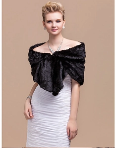 Elegant black faux fur shawl for women evening wear paired with a white formal wedding dress