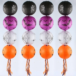 Halloween decorative paper lanterns with pumpkin and ghost patterns and colorful tassels
