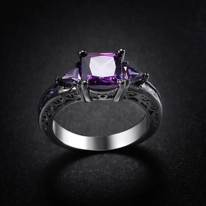 Gothic black gold ring featuring a purple square zircon and intricate vine cutout