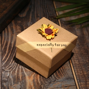 Detail of kraft paper gift box with dried sunflower and especially for you banner