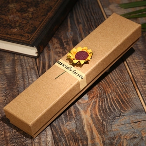 Close-up of kraft paper gift box with yellow sunflower and 'especially for you' seal
