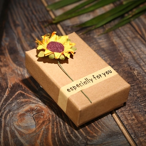 Brown kraft paper gift box with sunflower and Especially for You tag on wood