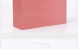 Detail view showing bottom construction of pink bag and handle of white kraft paper bag