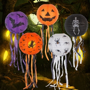 Hanging Halloween paper lanterns with assorted ghost and pumpkin patterns and tassels