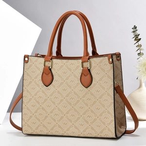 Macro shot of Oumifei beige canvas tote bag with brown leather trim in minimalist studio setting