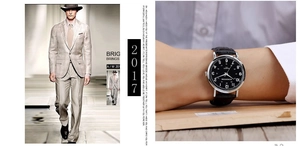 Close-up of elegant black leather strap watch with silver case on a man's wrist