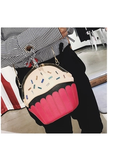 Detail of creative cupcake shaped crossbody bag with colorful crystal studs and chain strap