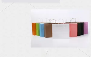 Detailed view of colorful shopping paper bags with sturdy twisted handles for retail use