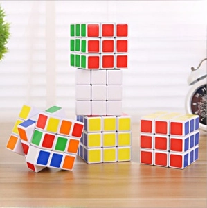 Classic 3x3x3 speed cube set in color box packaging displayed on a wooden table