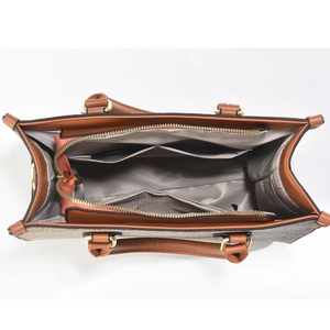 Interior view of tote bag featuring gray chevron lining and practical storage pockets