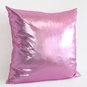 Pink metallic faux leather throw pillow case with a modern glossy finish on white background