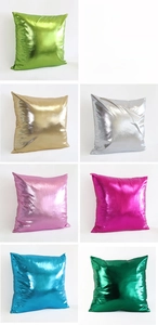 Close-up of metallic faux leather cushion covers in vibrant colors with mirror finish