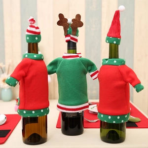 Christmas wine bottle covers with red and green embroidery and matching mini hats