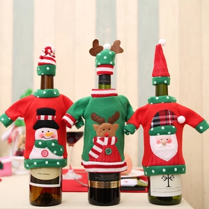 Three festive Christmas wine bottle covers with knitted sweaters and mini hats set