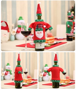 Detail of Christmas wine bottle cover set featuring knitted Santa hat and coat style